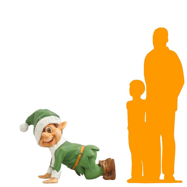 Green Elf Crawling Over Sized Statue