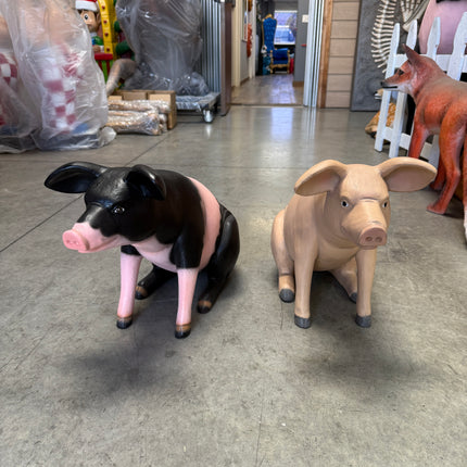Baby Sitting Black And Pink Pig Life Size Statue