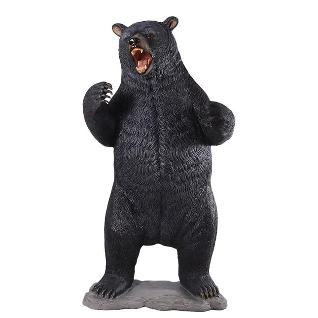 Black bear figurine standing on its hind legs with a raised paw on a white background