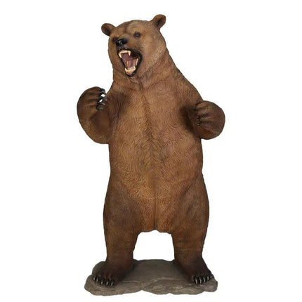 Brown bear figurine standing on its hind legs with a white background