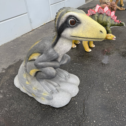 Sitting Juvenile Theropod Dinosuar Life Size Statue