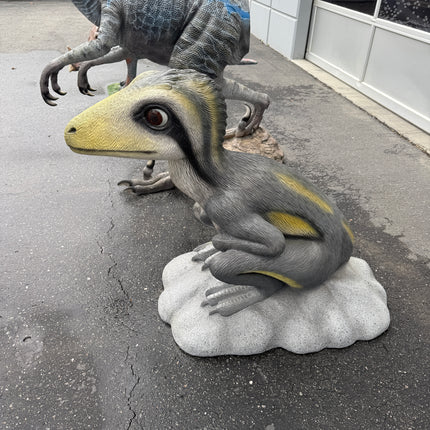 Sitting Juvenile Theropod Dinosuar Life Size Statue