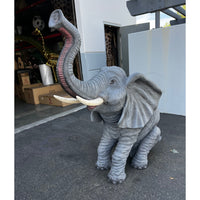 Baby Sitting Elephant Trunk Up With Tusks Statue - LM Treasures 