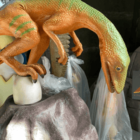 Compsognathus Dinosaur On Rock Life Size Statue - LM Treasures Life Size Statues & Prop Rental